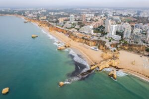 Aerial drone view of Portimao skyline and city beach of Praia da Rocha , Algarve,Portugal
