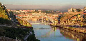 Aerial view of the Ponte Dona Maria Pia bridge connects the coasts of Vila Nova de Gaia