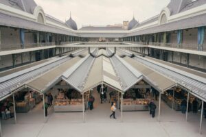 Bustling mercado de bolhao in Porto, Portugal featuring local vendors and shoppers