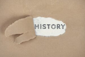 The word History on a ripped paper